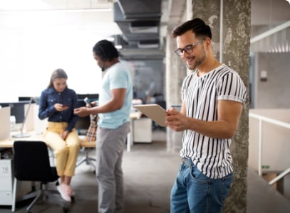 man looking at tablet in the office 