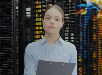 Lady with clipboad in front of a server