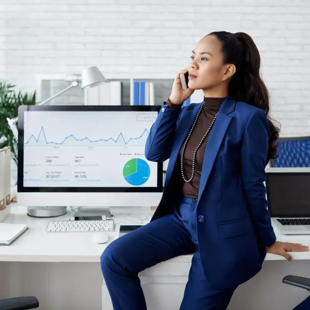 lady on phone in her office