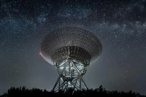 Satalite in night sky with stars