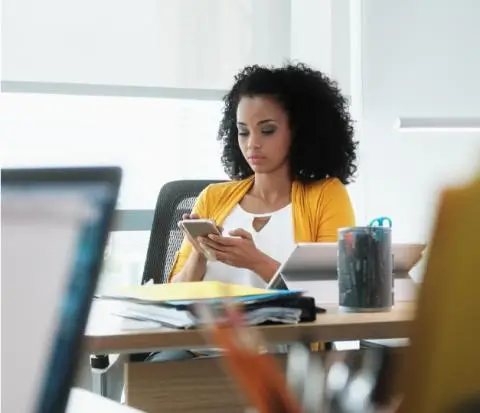 lady on phone while working from her desk