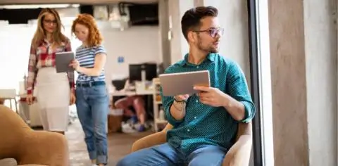 people working from their tablets