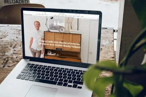 laptop with a website open on the screen