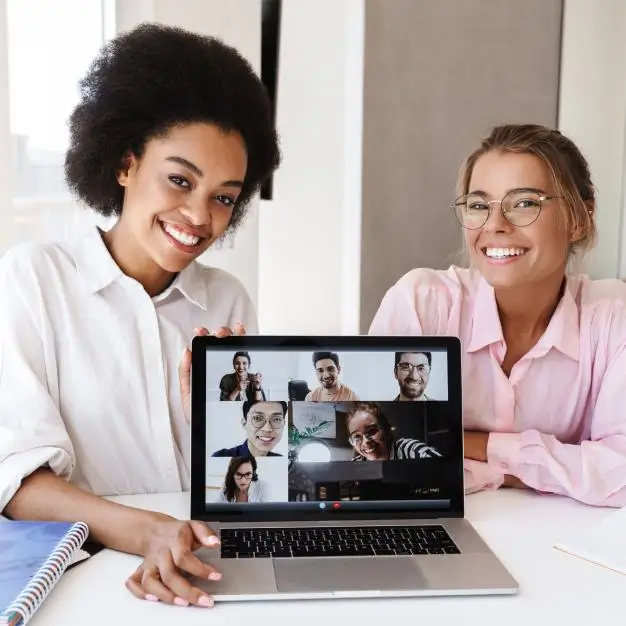 2 ladies with conference call on computer