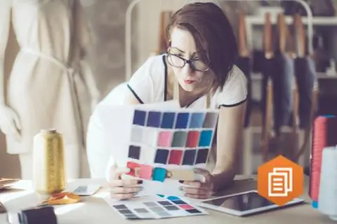 women looking at colour palets in her workshop