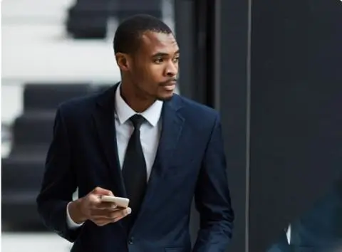 Man waliking with his phone in his hand