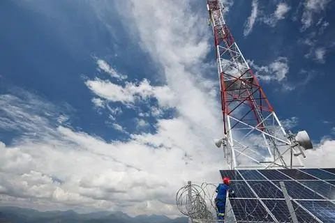 A person workin on a cellphone tower 