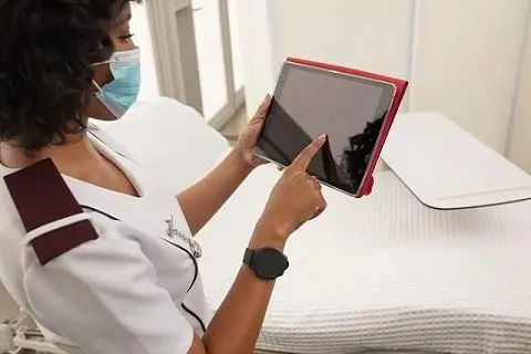 Nurse looking at her tablet