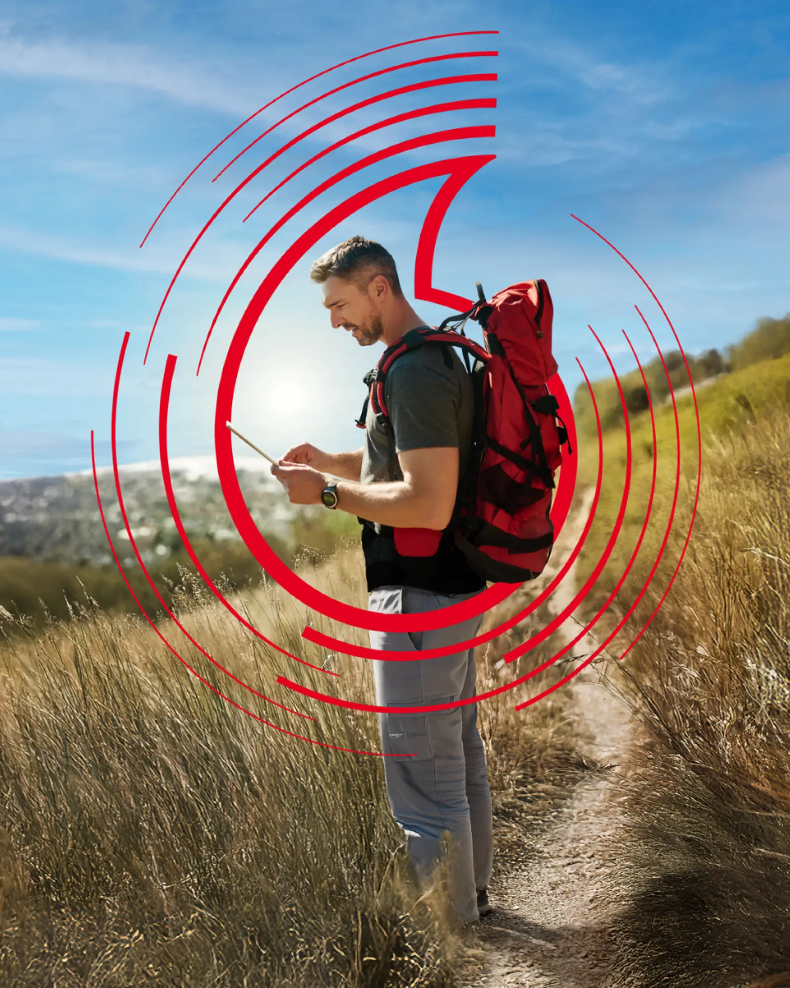Man hiking outdoors using his phone
